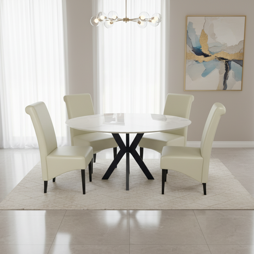 Dining room with a round white table and four cream-colored chairs on a light wood floor.