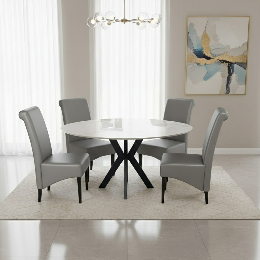 Dining room with a round white table and gray chairs in a modern interior setting.