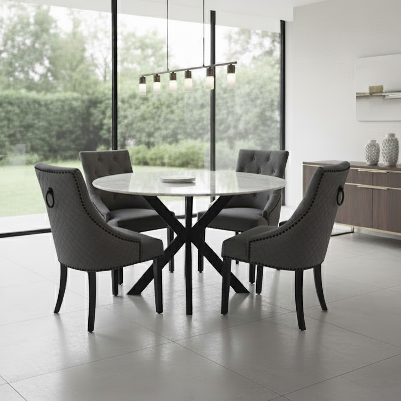 Modern dining room with a round table and chairs near large windows.