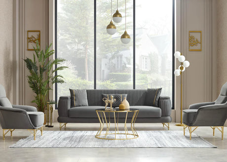 Modern living room with gray sofa, armchairs, and a gold coffee table.