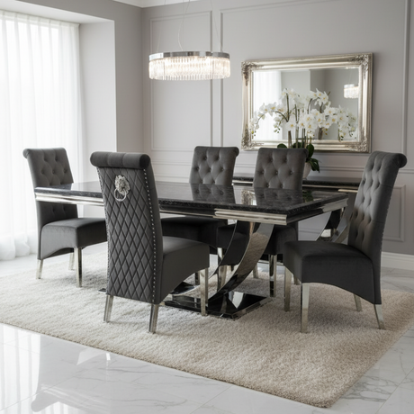 Modern dining room with a black glass table and gray tufted chairs.
