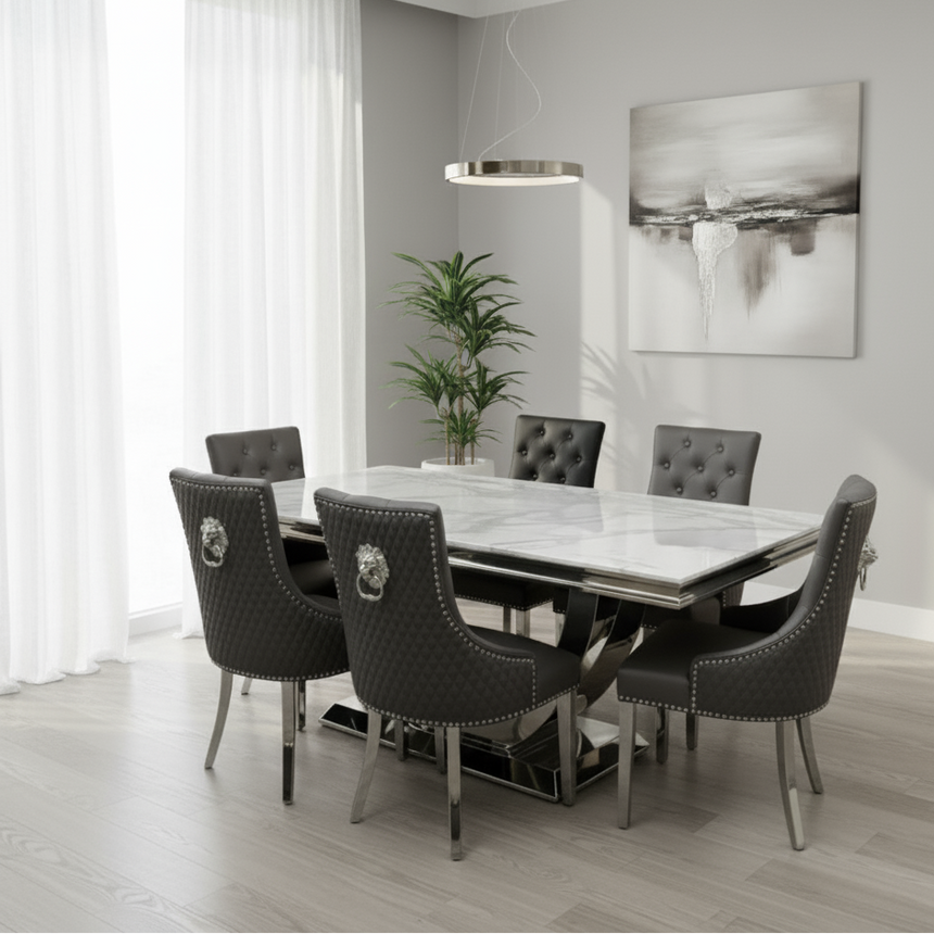 Modern dining room with marble table and gray chairs in a bright room.