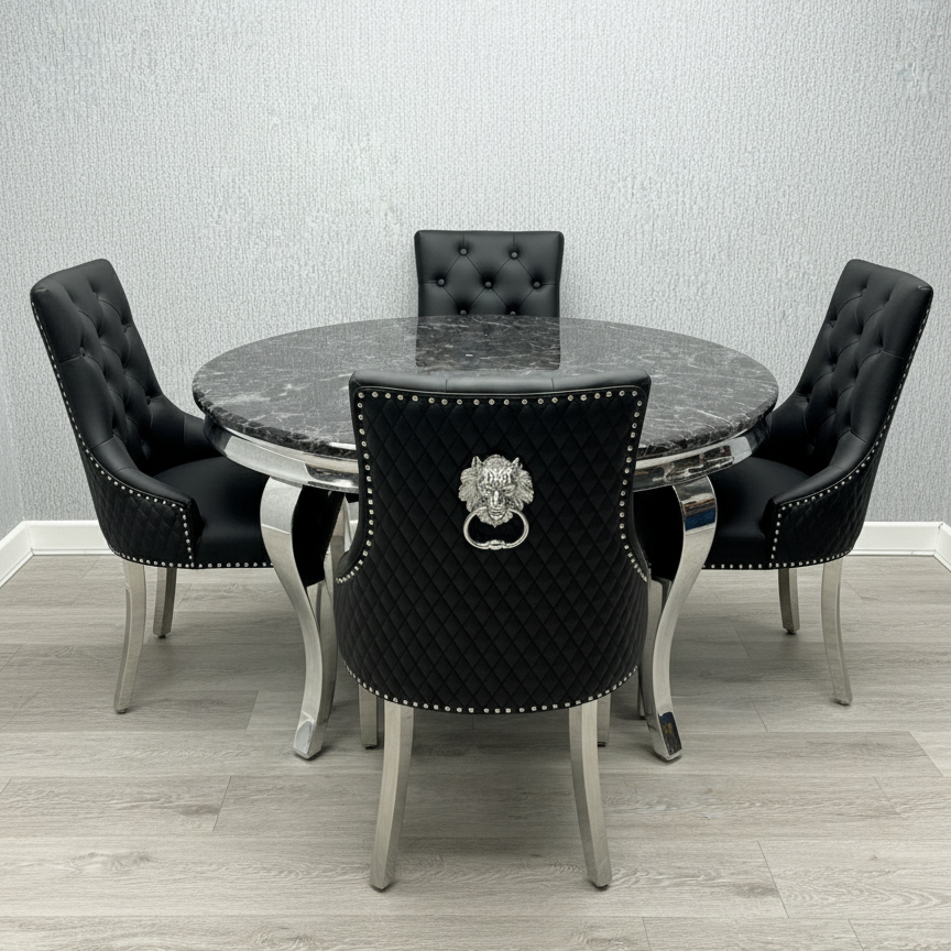 Dining table set with black tufted chairs against a gray wall.