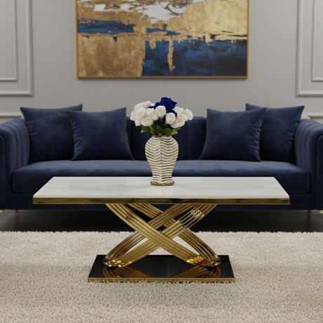 Living room with a blue sofa, gold coffee table, and abstract painting on the wall.