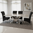Modern dining room with a marble table and black chairs.