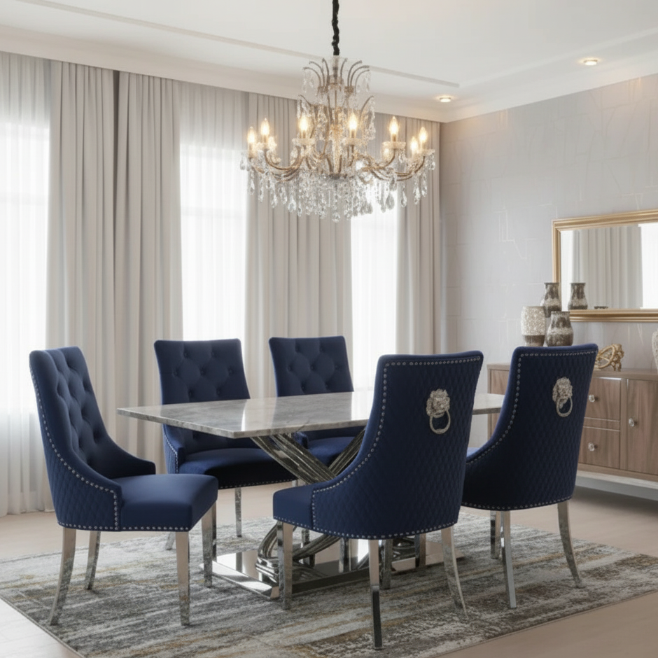 Dining room with blue chairs, marble table, and chandelier.