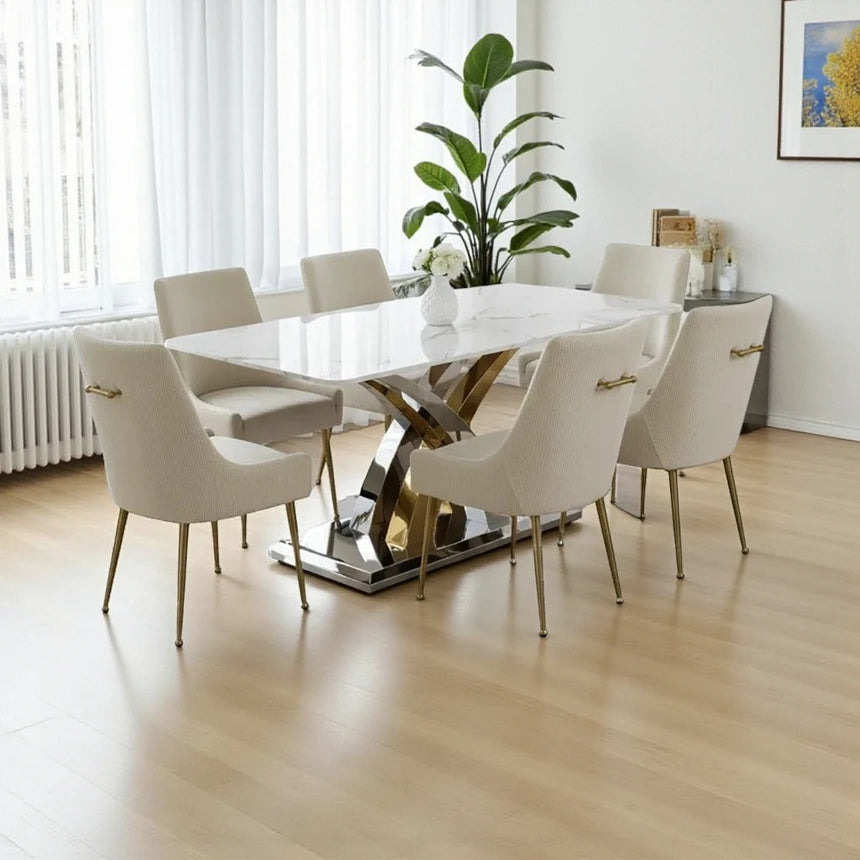 Dining room with a modern table and chairs on a wooden floor.