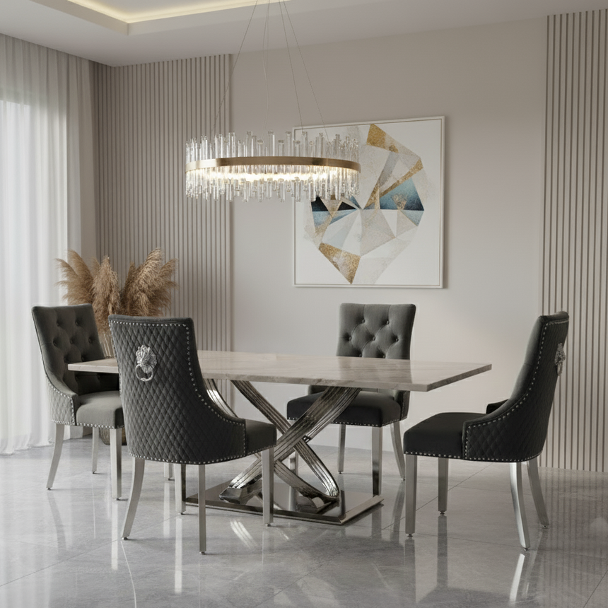 Modern dining room with a table and chairs, chandelier, and abstract art on the wall.