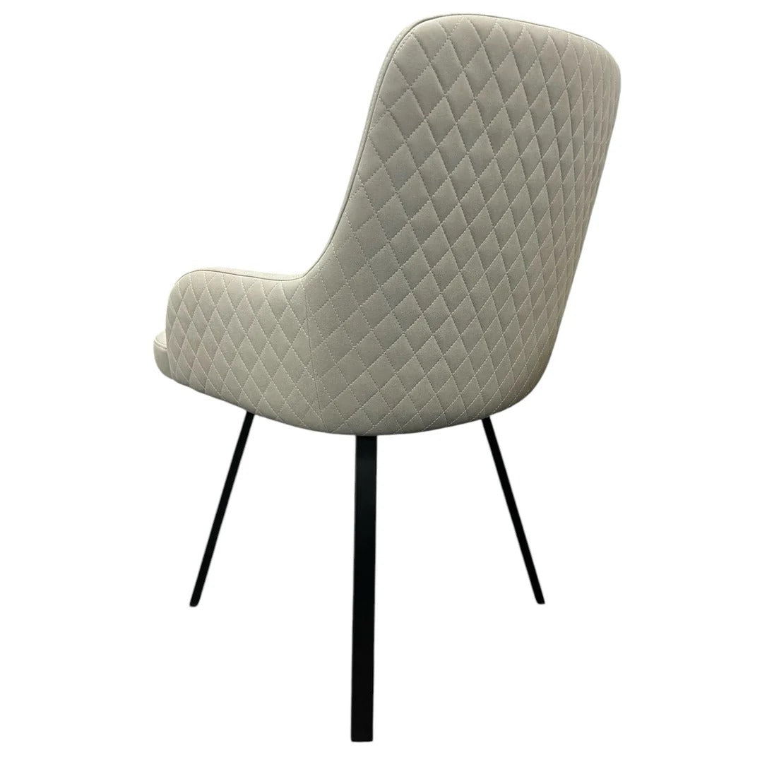 Chair with quilted design on a white background