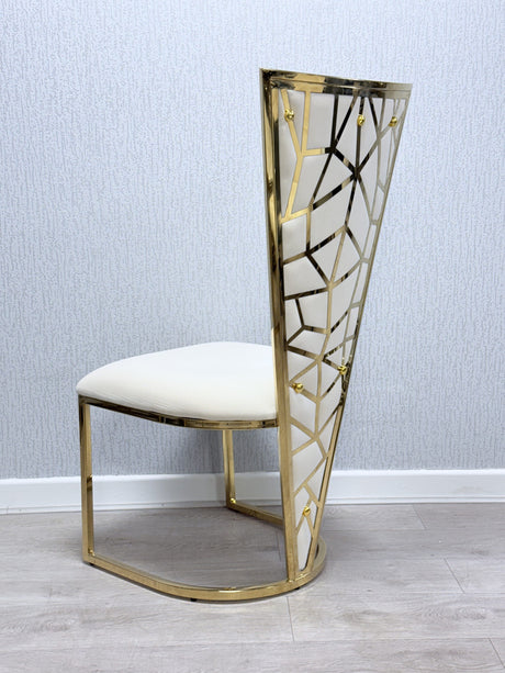 Gold and white chair with geometric design against a light blue wall.